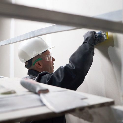 man-puttying-wall-at-construction-site-2025-06-05-23-29-10-utc man-puttying-wall-at-construction-site-2025-06-05-23-29-10-utc